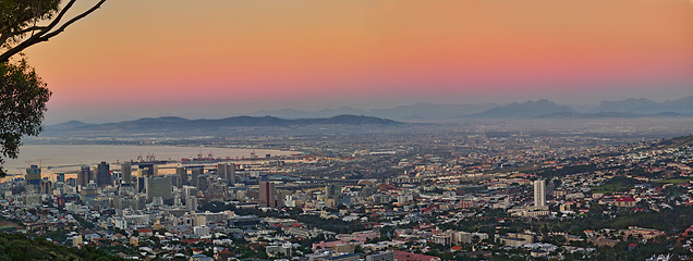 Image showing Sunset, architecture and city of Cape Town in South Africa for travel, journey and adventure in nature. Landscape, sea and holiday or vacation for freedom, above and mountain as location for tourists