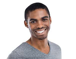 Image showing Portrait, smile and satisfied with young black man in studio isolated on white background for optimism. Face, happy and excited with confident person in casual tshirt feeling carefree or cheerful