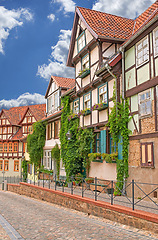 Image showing Village, buildings and facade with heritage, architecture in traditional, culture and retro as tourist attraction in Germany. House, vintage and street in countryside, neighborhood or community