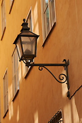 Image showing Travel, wall and lantern on vintage building in old town with history, culture or holiday destination in Denmark. Vacation, architecture and antique lamp in Europe with retro light in ancient city