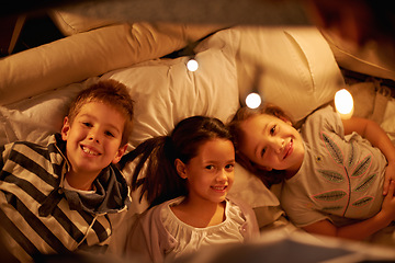 Image showing Children, above and portrait of siblings in a bed with love, support and trust while bonding at home together. Family, night and face of kids in a bedroom for evening games, playing or indoor camping