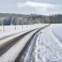 Image showing Snow, road or nature with countryside travel, holiday and vacation scenery in Denmark or forest. Background, sky or street for journey, tourism or outdoor adventure with woods, trees or winter season