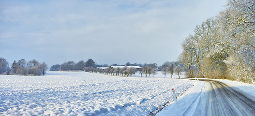 Image showing Snow, road or forest with countryside travel, holiday and vacation scenery in Denmark or nature. Background, sky or street for journey, tourism or outdoor adventure with woods, trees or winter season