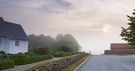 Image showing Home, road or village with countryside travel, holiday and vacation scenery in Denmark or nature. Background, sky or street for journey, tourism or outdoor adventure trip with woods, trees or clouds