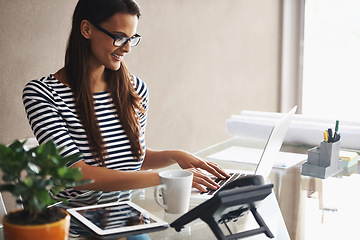 Image showing Woman, desk and typing on laptop with research for article, checking email or editing in office. Writer, smile and thinking with technology for idea, planning or online communication at workplace