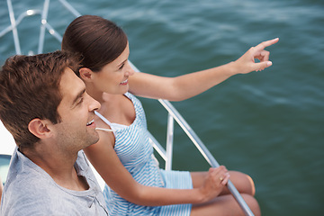 Image showing Happy couple, boat and romantic cruise for honeymoon, pointing and looking at ocean horizon. Smile, yacht and luxury on the water transportation, holiday and travel in Bora Bora for tourism