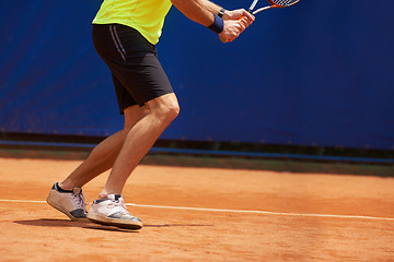 Image showing Person, legs and competition on tennis court, athlete and serve racket or ball for professional match. Fitness, outdoor or player in sport training for tournament or skill of strong champion in game