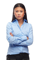 Image showing Portrait, frustrated or asian woman with arms crossed in studio for poor feedback, results or review on white background. Angry, face or female model posing with bad mood, attitude or moody behaviour