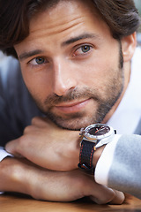 Image showing Man, fashion and watch for thought, thinking and handsome in beard, jersey and lean on table in closeup. Businessman, formal and vision for salesman, idea and professional job with serious look