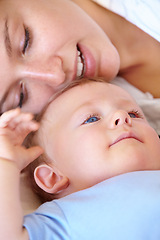 Image showing Baby, bonding and happy with mom, relaxing and love together with child and care for motherhood. Infant, mother and smile for affection, nurture and home for growth and babysitting with family