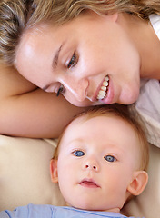 Image showing Baby, cute and happy with mother, relaxing and love together with child and care for motherhood. Infant, mom and smile for affection, nurture and home for growth and babysitting with family bonding