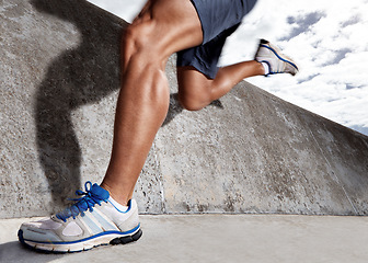 Image showing Legs, workout and athlete running on road for energy, exercise and practice for marathon in city. Mock up, person and runner in street for cardio of speed for momentum in sports and wellness