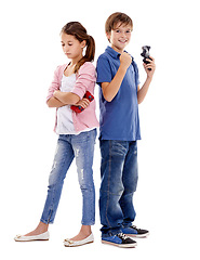 Image showing Children, siblings and winner with loser for video games, competition or esports on a white studio background. Boy and girl with smile and disappointment for gaming victory or loss on mockup space