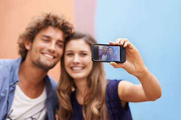 Image showing Couple, screen and portrait with cellphone for picture, selfie and post for social media on summer vacation. Man, woman and together for memory on holiday with digital photo on smartphone for online