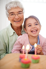 Image showing Cupcakes, child and granny with birthday, girl and laugh with happiness, candy and cheerful kid. Grandmother, celebration or excited with dessert or portrait with party or box with wow, sweet or home