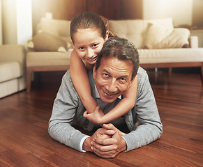 Image showing Portrait, home and grandfather on the floor, girl and happiness with love and vacation. Face, apartment and elderly man with grandchild or bonding together with fun and playing with holiday and relax