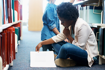 Image showing Woman, library and reading book on floor for education or english project for university, scholarship or college. Female person, campus and academic exam in USA for research, lesson or literature
