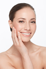 Image showing Woman, touching face and skincare, beauty and natural cosmetics with dermatology on white background. Hands, skin and self care, clean facial and wellness, model in portrait with glow in studio