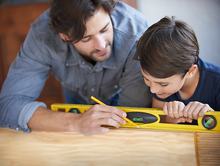 Image showing Father, kid and wood work at home for carpenter, bonding and building with safety gear. Dad, son and builder for renovating, measuring and teaching moment for development of house with learning