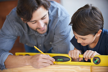 Image showing Dad, kid and woodwork pencil for project, bonding and building with safety gear. Father, son and carpenter for renovating, measuring and teaching moment for development of house with spirit level