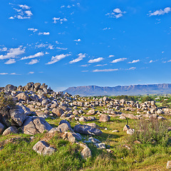 Image showing Mountains, rocks and nature with blue sky for travel, hiking and eco friendly tourism or explore location in Cape Town, South Africa. Background of landscape, environment and field by the countryside