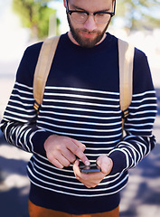 Image showing College, phone and man in outdoors for website, student and scrolling on university app or internet. Town, male person and typing a message or check email, online and communication or education