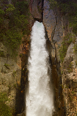 Image showing Mountain, waterfall and nature for background with travel, tourism and scenic view outdoor. Adventure, hiking and natural spring water for environment, landscape and location for summer vacation