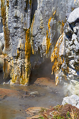 Image showing Rocks, closeup of dam and water for nature, background or landscape with ecosystem. Stone, jagged edge and textures with stream in river, natural resource and element for sustainability and liquid