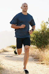 Image showing Runner, man and marathon on trail with fitness for sport, training and exercise for competition on mountain. Athlete, person and running with wellness, challenge or cardio for healthy body in Denmark