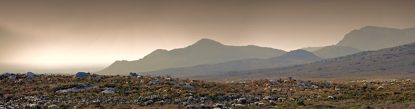 Image showing Mountain, landscape and banner at sunset with rock, texture or summer countryside in Africa. Morning, outdoor and journey to hill on horizon with bush, grass and environment in nature with stone