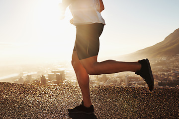 Image showing Legs, shoes and running in street for fitness outdoor, cardio and health with sunshine and training for marathon. Sports, exercise with athlete person with workout, wellness and endurance in city