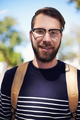 Image showing Man, portrait and university student in outdoors, smile and morning commute to college. Happy male person, backpack and campus for learning or education, knowledge and ready for course and confident