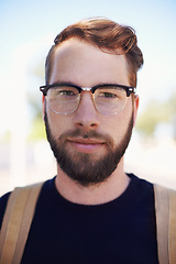 Image showing Man, portrait and university student in outdoors, travel and morning commute to college. Male person, backpack and campus for learning or education, knowledge and ready for course and confident