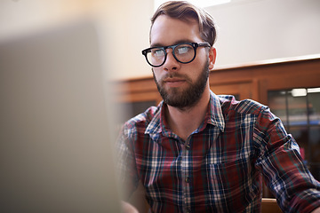 Image showing Man, laptop and glasses for planning, freelancer and online or email for communication. Male person, remote work and notification in home office, reflection and browse on internet or app and website