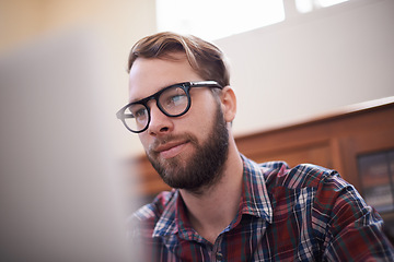 Image showing Man, laptop and glasses for internet, freelancer and online or email for communication. Male person, remote work and notification in home office, reflection and browse for research on app and website