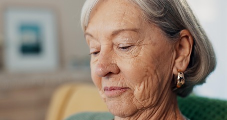 Image showing Face, thinking or memory with senior woman on sofa of living room in home to relax for retirement. Peace, wellness or nostalgia with elderly person closeup in apartment for break, rest or time off