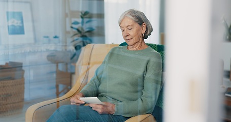 Image showing Photograph, memory and senior woman in living room thinking with nostalgia or history. Remember, album and elderly female person in retirement looking at pictures on sofa in lounge at house.