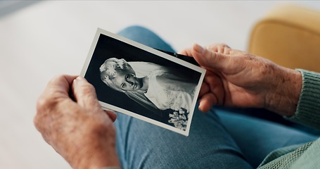 Image showing Hands, photograph and old person in retirement with memory, relax with history for nostalgia and think about life. Remember, past and wedding photography with bride, retro picture and rest in lounge