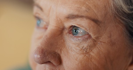 Image showing Eyes, thinking and senior woman at nursing home with fear, stress and worry or depression in closeup. Anxiety, face and elderly lady with nostalgia, doubt and dementia for memory loss or Alzheimer