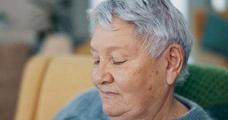 Image showing Face, memory or nostalgia with senior woman on sofa of living room in home to relax for retirement. Peace, thinking or wellness with elderly person closeup in apartment for break, rest or time off