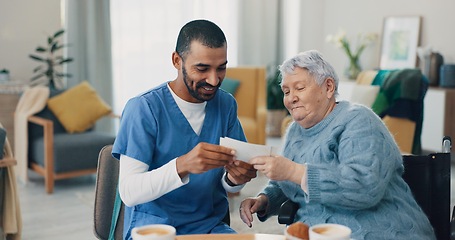 Image showing Nursing home, photo album and caregiver with old woman in retirement, break and bonding together. Love, memory or senior person with pictures for support or nostalgia with care, nurse or conversation