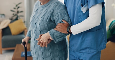 Image showing Nurse, senior person and holding hands with walking stick for support at retirement home. Elderly patient with a disability, caregiver or cane in rehabilitation for health, physical therapy or help