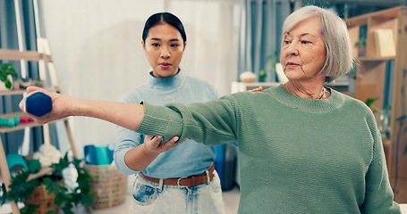 Image showing Senior care, therapy and physiotherapist with old woman, dumbbell and healthcare for fitness. Physio, rehabilitation and retirement with training, caregiver with elderly patient for mobility exercise