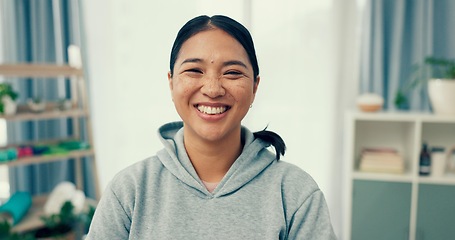 Image showing Portrait, wellness or happy woman in home to relax in living room on holiday in hotel, house or apartment. Face, pride or Asian person with peace, smile or confidence on break to rest for alone time