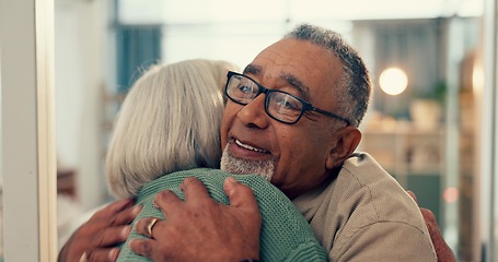 Image showing Love, hug and senior couple in home, together and support, trust or care during retirement. Diversity, smile and happy with elderly man, woman and embracing for romance in their house for wellness