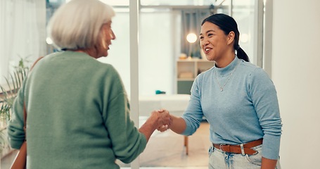 Image showing Happy woman, physiotherapist and handshake in elderly care, appointment and meeting at hospital clinic. Female person, medical and healthcare professional shaking hands with senior patient in checkup