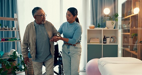 Image showing Woman, physiotherapist and senior patient, walking and elderly care for helping movement or balance at clinic. Female nurse, physio and caregiver, assisting and mature man or person with a disability