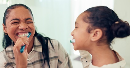 Image showing Happy, brushing teeth and mother with daughter, wellness and child development in bathroom. Smile, family or mama with kid and healthy with morning routine or toothbrush with fresh breath or dental