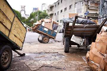 Image showing Garbage, cart and trash in city outdoor for waste management, recycling and rubbish in neighborhood. Community, scrap and boxes of junk material in sao paulo with dump collection, old litter and pile