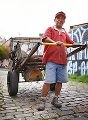 Image showing Man, portrait and cart for trash in street for smile, walk and collect garbage for recycling for ecology. Person, rickshaw or barrow for sustainability, environment and favela on road in Sao Paulo